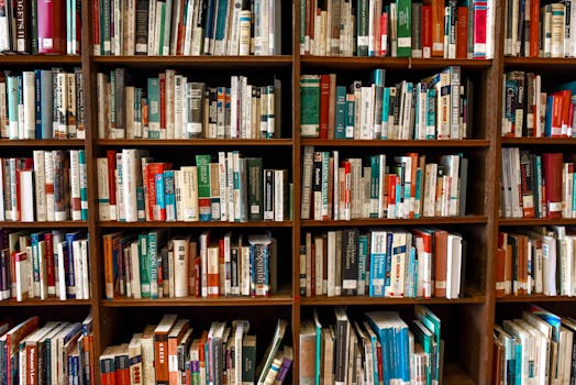 Vibrant library scene featuring wooden bookshelves filled with various books.
